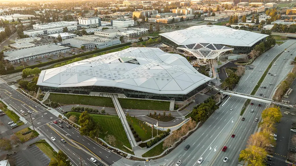 Aerial view of the Nvidia headquarters, featuring modern buildings with geometric, faceted white roofs.