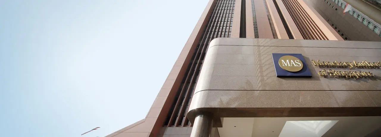 Low angle shot of the Monetary Authority of Singapore building facade with the MAS logo