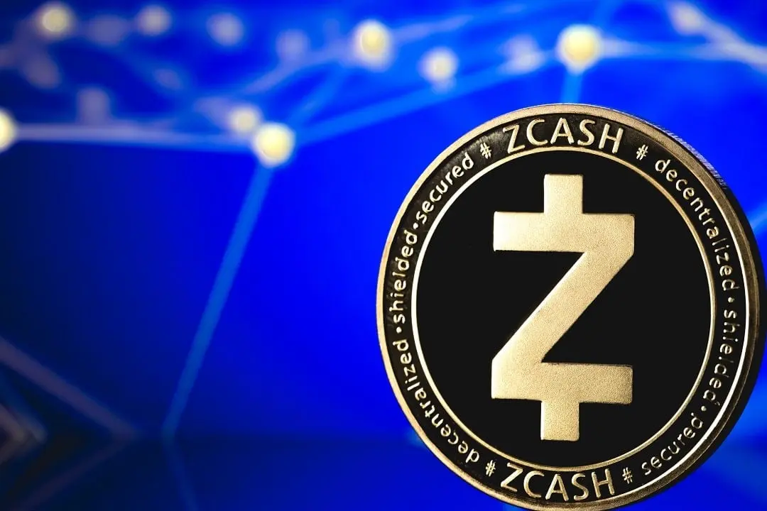 Close-up of a physical Zcash cryptocurrency coin with the ZEC symbol against a blue digital network background