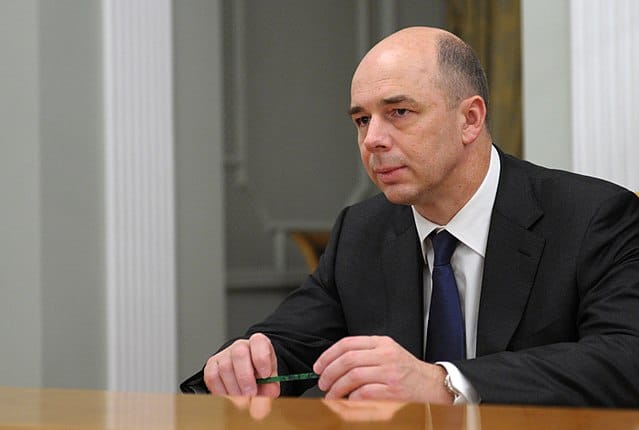 Russia&rsquo;s Finance Minister Anton Siluanov sits at a table.