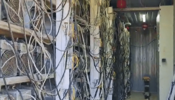 Banks of illegal crypto mining rigs, in footage released by the Russian Ministry of Internal Affairs.