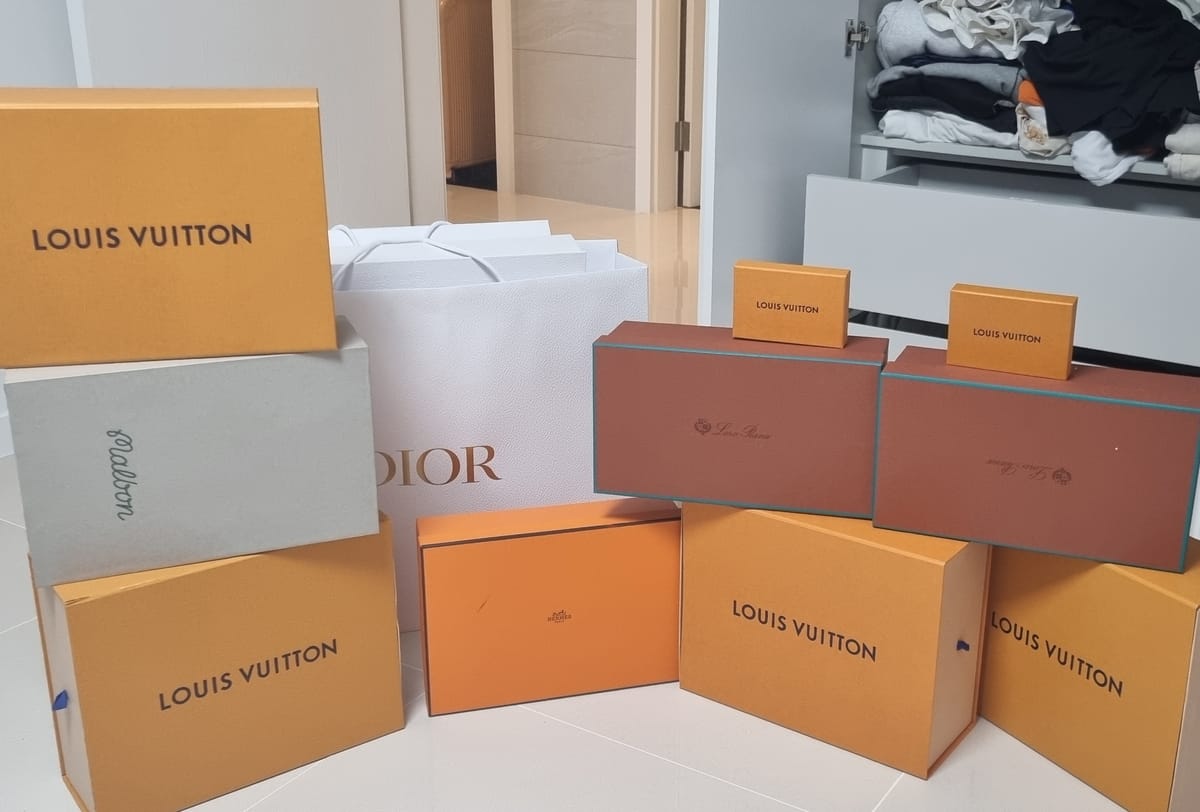 Boxes of luxury goods seized by police during raids on the &ldquo;fake crypto mining&rdquo; group&rsquo;s suspected mastermind.