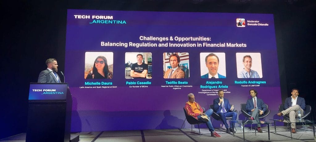 Alejandro Rodr&iacute;guez Ariola, a lawyer at the Department of Inspections and Investigations, National Securities Commission (seated, second from left), speaks at the Tech Forum summit in Buenos Aires on October 19.