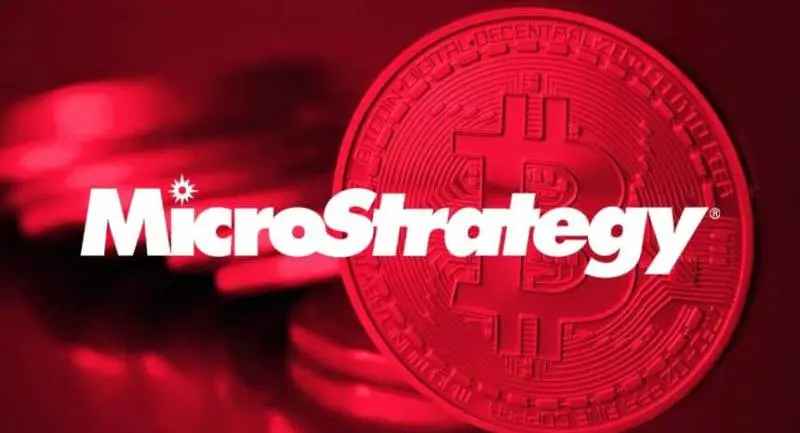 MicroStrategy company logo overlaid on a red-tinted image of Bitcoin coins