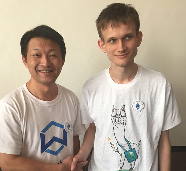 Jack Lu pictured with Vitalik Buterin