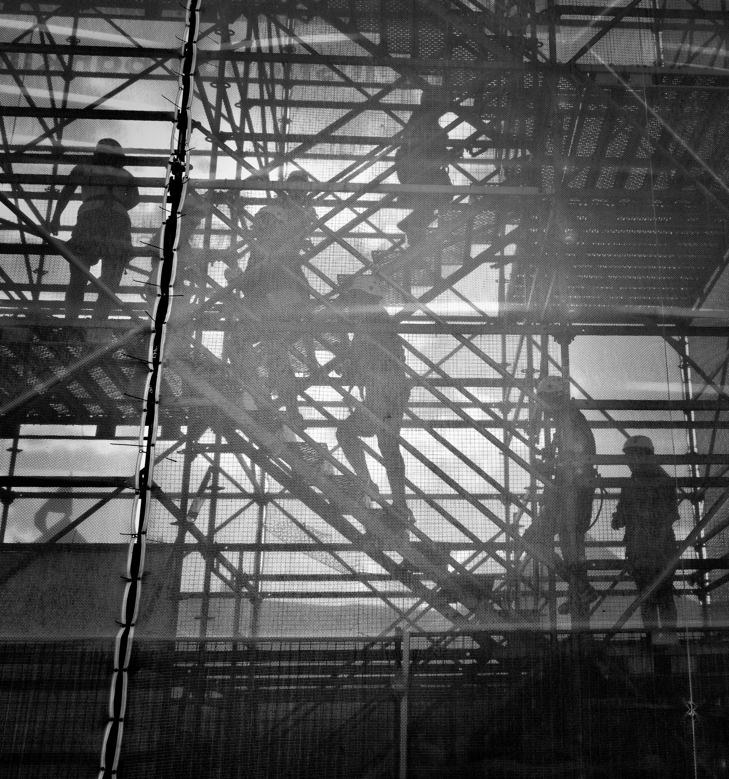 black and white photo of people going upstairs
