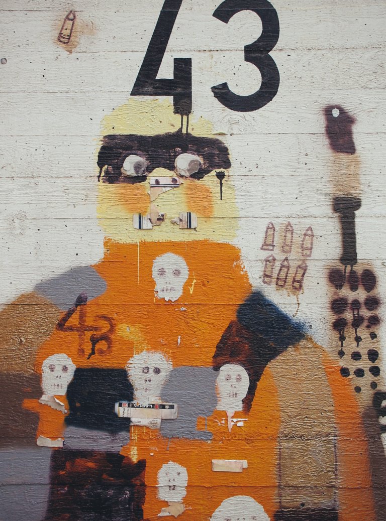 white orange and black wall graffiti