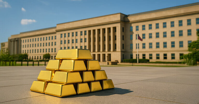 A bright, cinematic 16:9 photograph shows gleaming gold bars stacked on a sunlit stone plaza with the Pentagon’s beige facade and crisp blue sky in the background, balancing warm gold tones against cool blues and subtle greens.