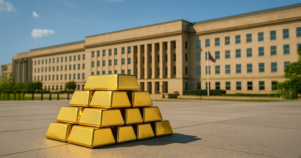 A bright, cinematic 16:9 photograph shows gleaming gold bars stacked on a sunlit stone plaza with the Pentagon’s beige facade and crisp blue sky in the background, balancing warm gold tones against cool blues and subtle greens.