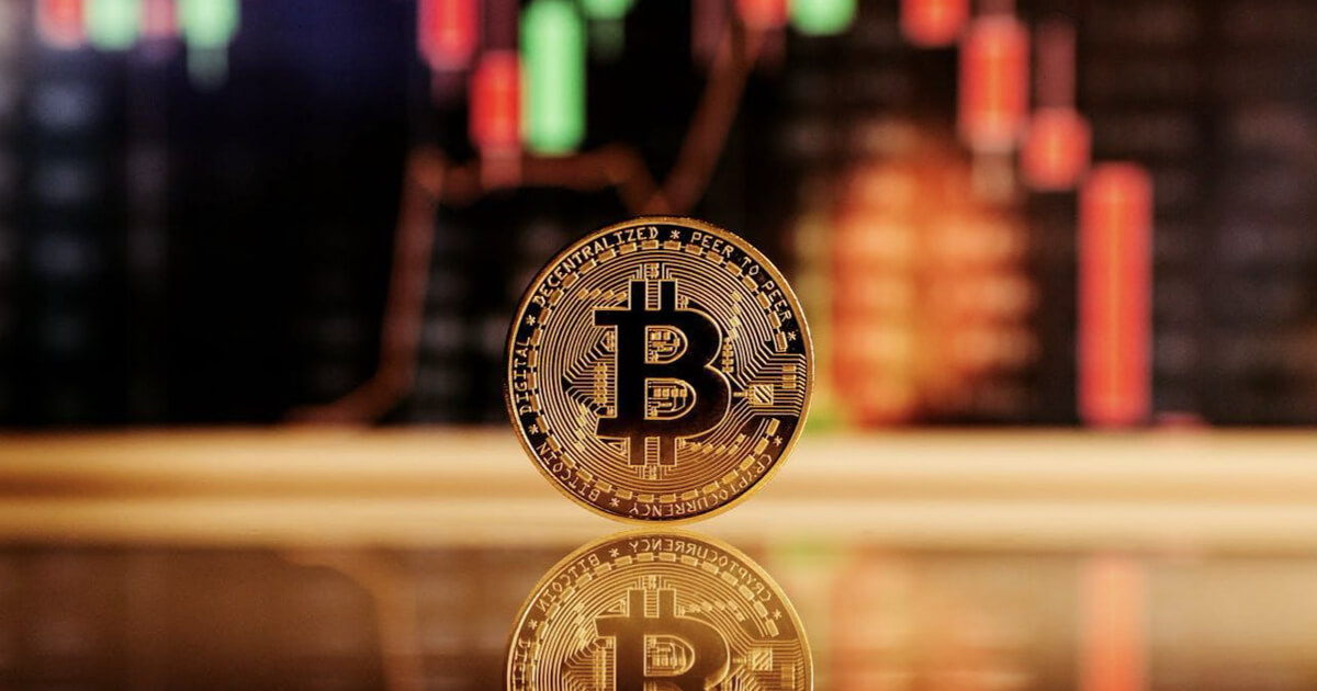 bitcoin token on a reflective surface