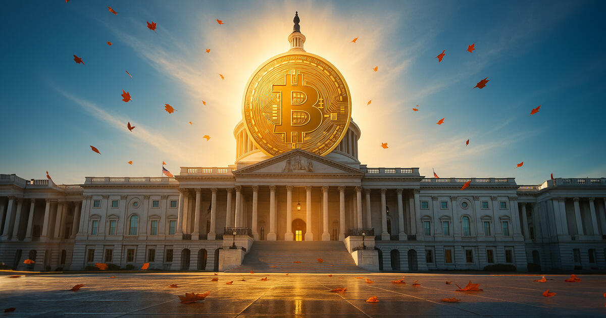 A massive golden Bitcoin rises behind the U.S. Capitol at sunrise, casting warm light across the marble steps and scattered autumn leaves under a clear blue sky.
