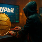 A hooded figure types in a dimly lit trading room with glowing monitors showing charts and the Upbit logo, while a large golden Solana coin floats in the foreground, symbolizing the surge of Solana-based tokens after the $32M Upbit hack.