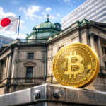 A Bitcoin coin stands outside the Bank of Japan with the Japanese flag above, highlighting concerns over liquidity as Japan’s 30-year bond yield hits a historic high.