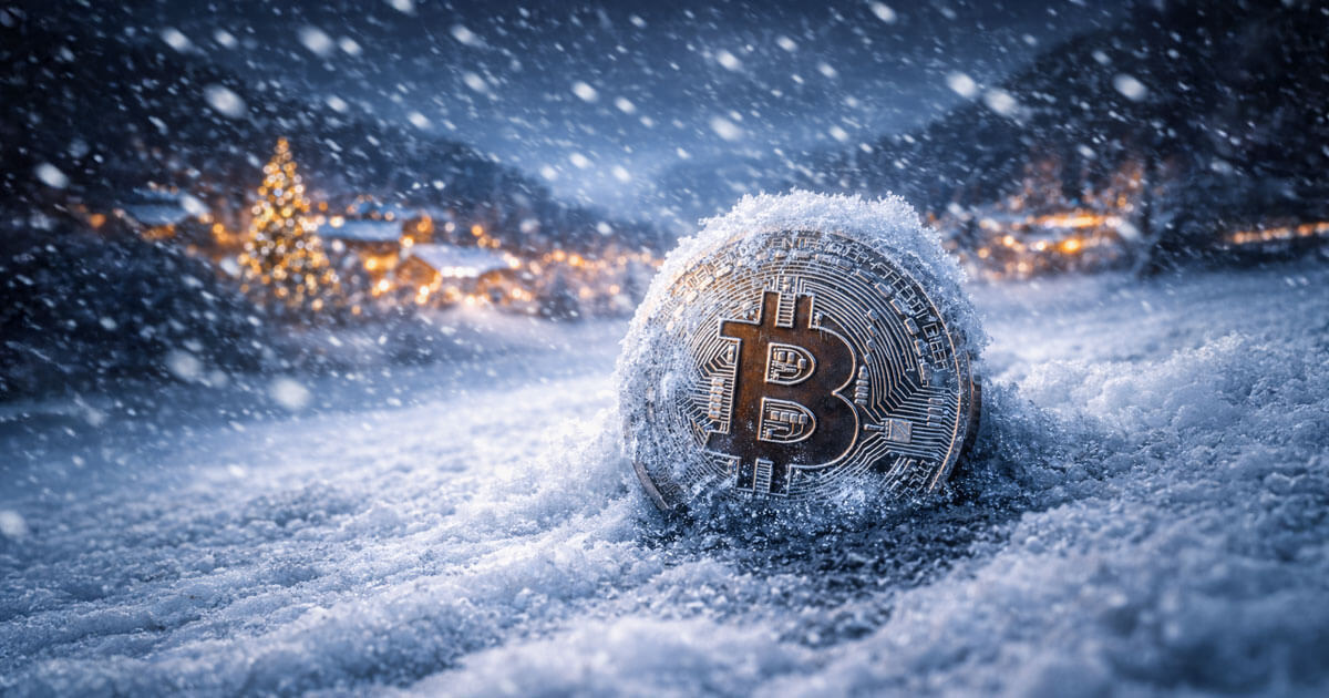 A Bitcoin coin sits half-buried in heavy snowfall, symbolizing cooling market sentiment as the asset records a $1.2B net outflow during the holiday season.
