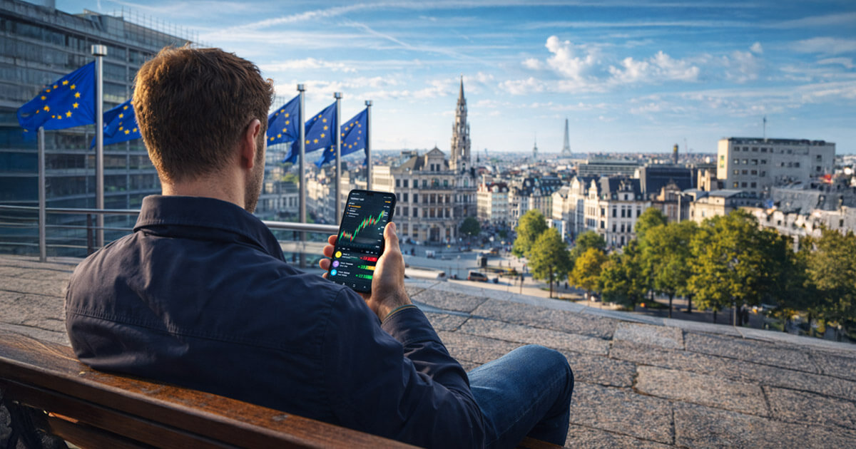 A man reviews crypto market data on his phone overlooking an EU landmark, reflecting new 2026 rules requiring crypto providers to collect tax information from residents.