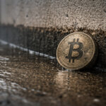 Bitcoin coin resting against a rain-soaked curb after a sharp sell-off, reflecting a surge toward $69,000 as Glassnode highlights a key level that could determine whether the rally fades