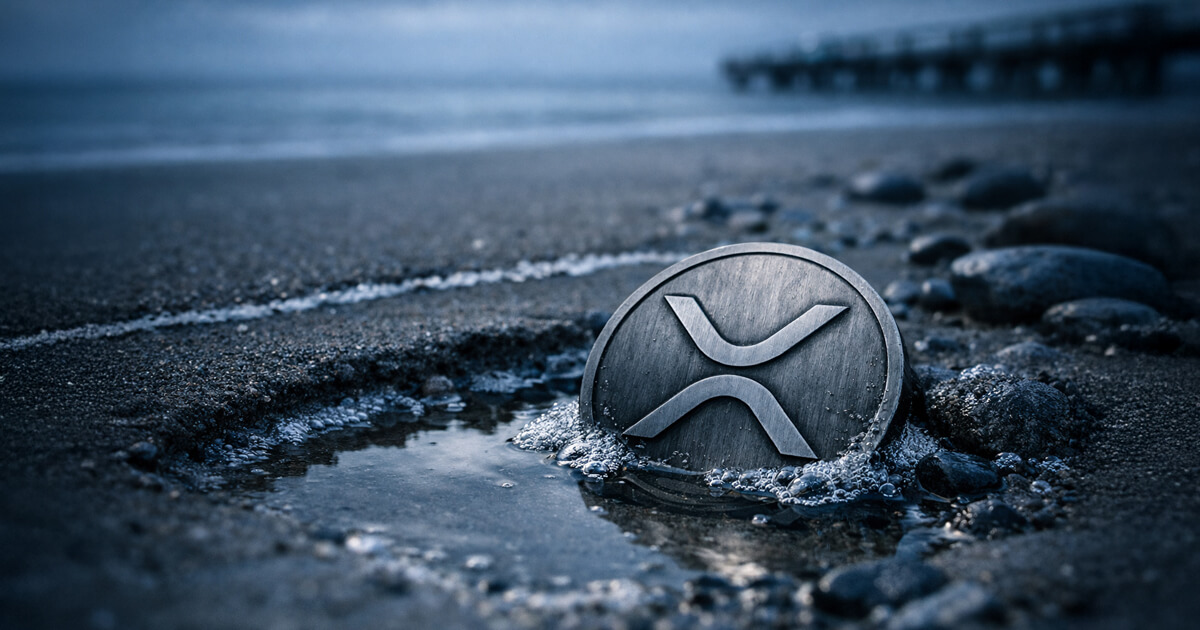XRP coin partially submerged in a shallow tide pool on a dark beach, reflecting a sharp weekend price dip in the cryptocurrency market