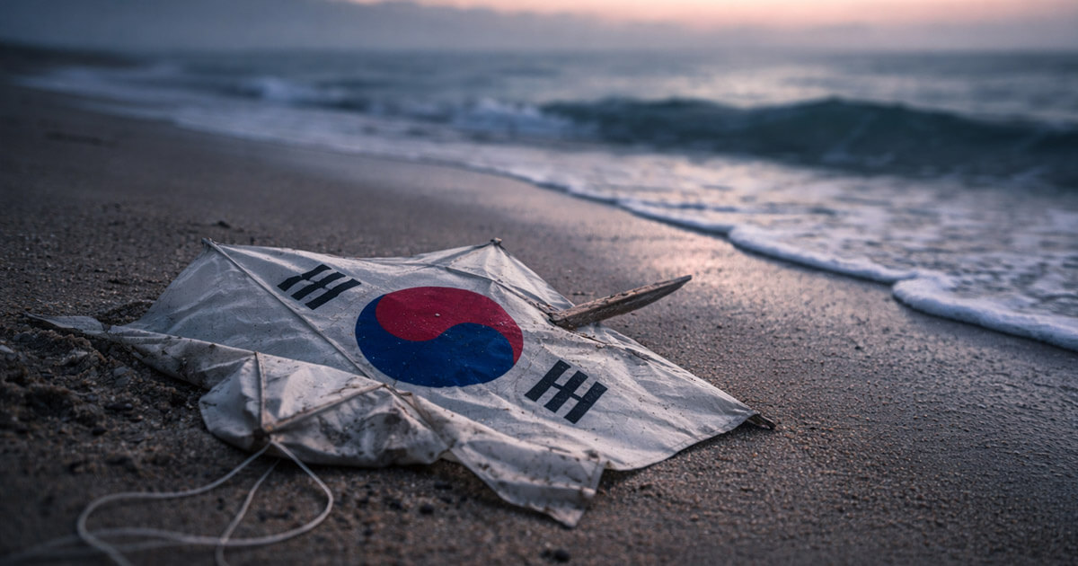 South Korean flag lying on a stormy beach as waves roll in, symbolizing Bitcoin surging past $71,000 during an 18% crash in South Korea’s stock market