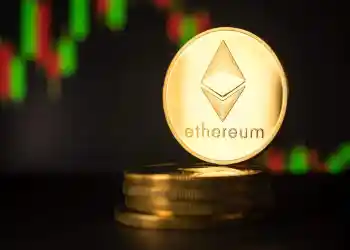 Picture of an Ethereum coin standing on top five stacked Etheruem coins, with a candlestick chart behind it