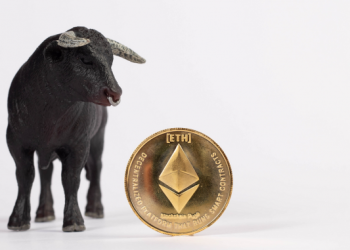 Picture of a bull standing next to an Ethereum coin