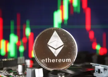 An ethereum in front of a market chart