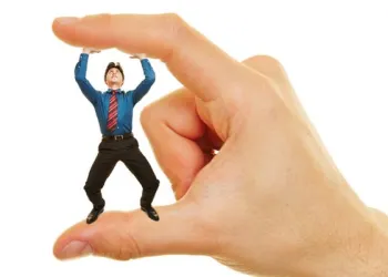 man being squishes between two fingers